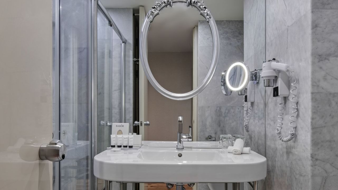 Bathroom vanity with amenities in Titanic Duplex Suite at Titanic Gendarmenmarkt Berlin