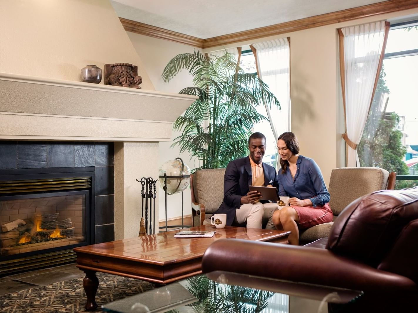 Couple discussing plans in the lounge area at Varscona Hotel on Whyte