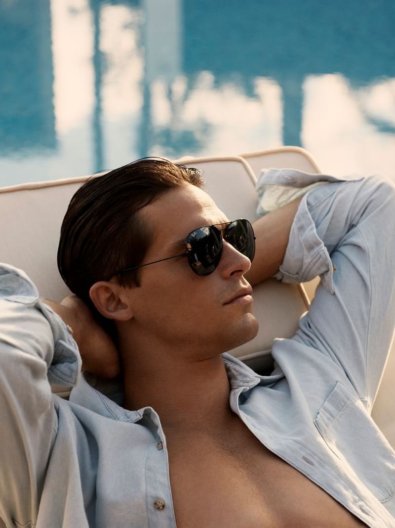 Close portrait of a man with shades relaxing at Crown Hotels