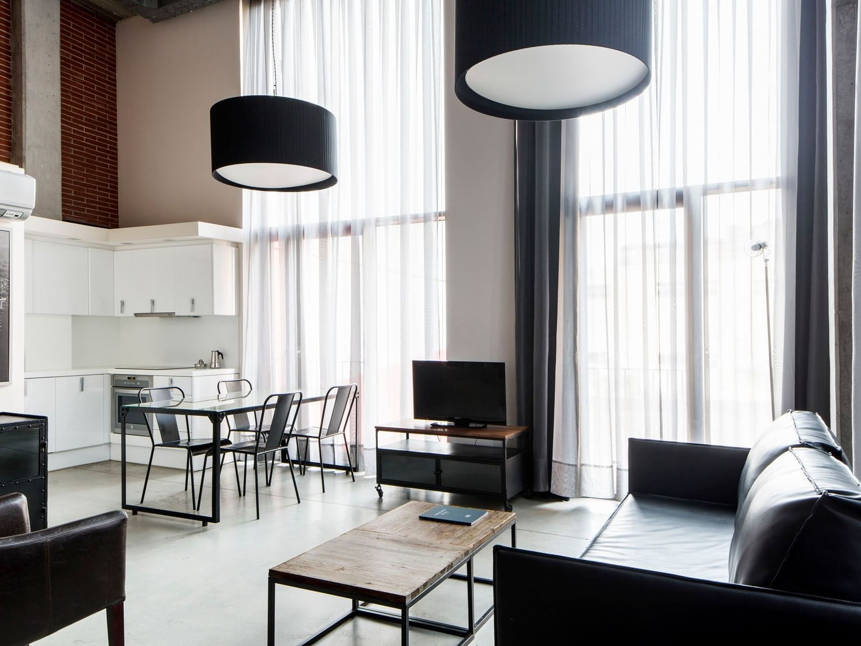 Dining & living area in Deluxe room at Barcelona Apartment