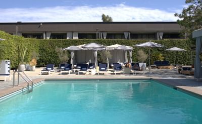 Women is pool cabana