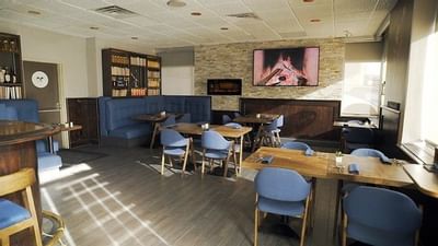 Restaurant dining tables & booth at Embassy Hotel & Suites