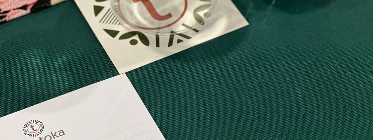 Tokatoka note paper, pen, wine glass, and water bottle at Talei Meeting Room in Nadi at Tokatoka Resort - Fiji International Airport