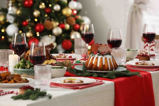 Close-up of table arranged with wine & treats for Christmas at The Danna Langkawi