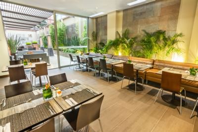 The arranged dining area with tables and chairs