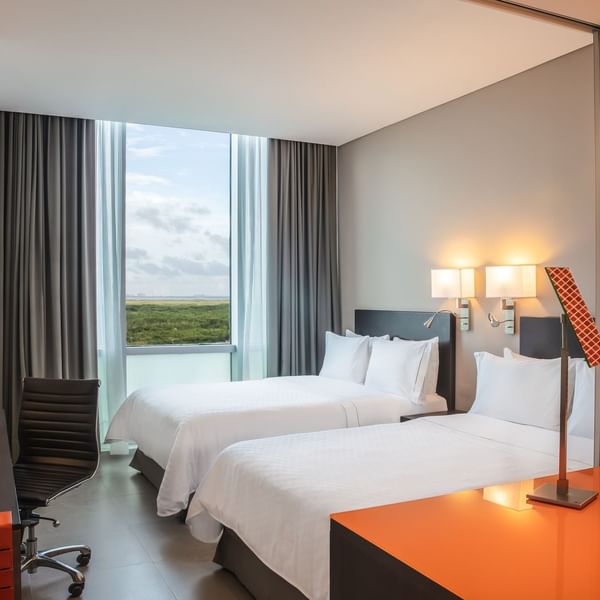 Twin beds in Deluxe Double Room with view at Fiesta Inn