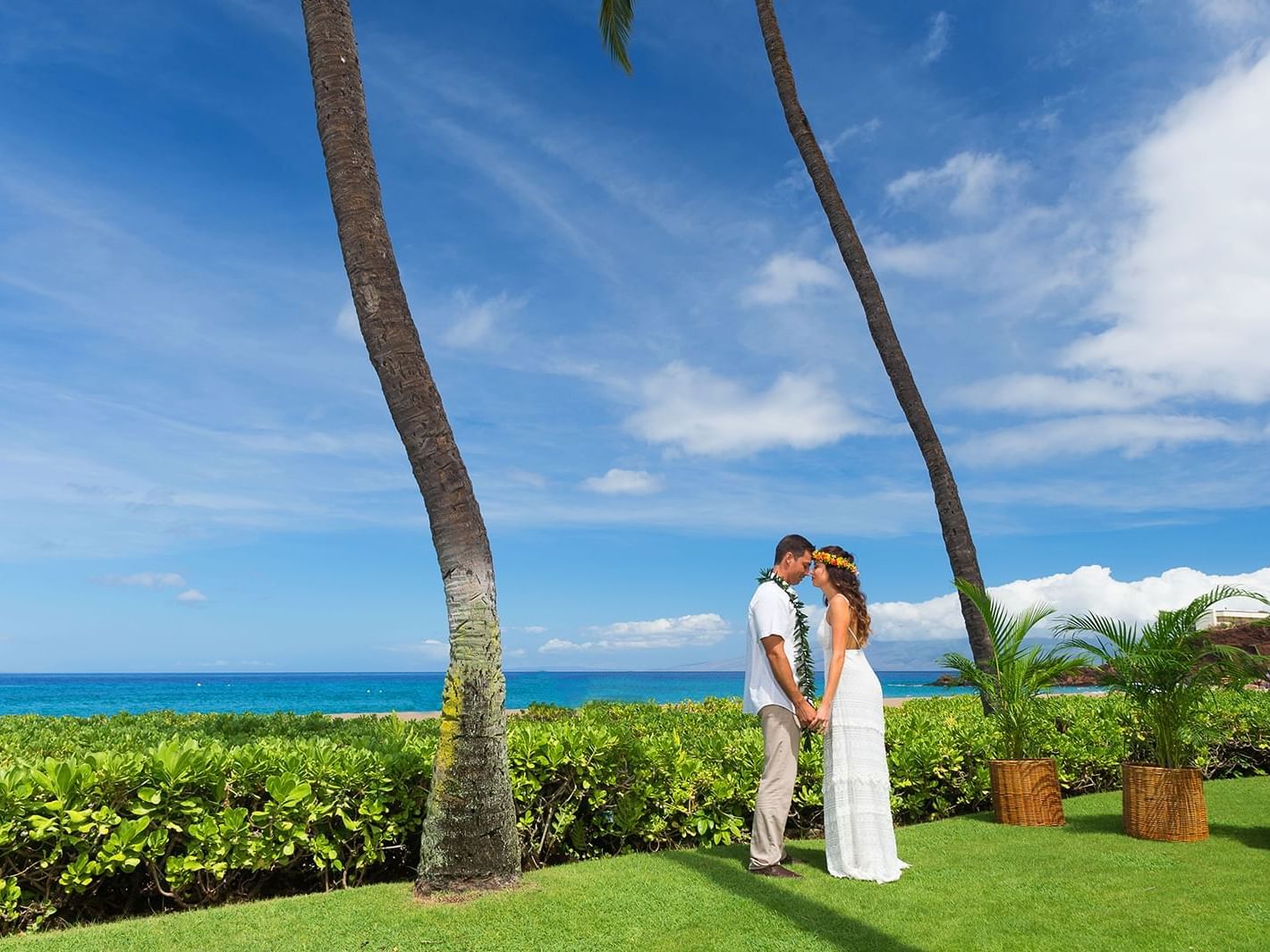 Wedded couple posing at Ka'anapali Hotel Beach Hawaii