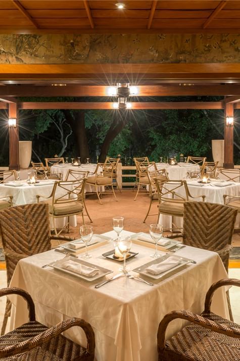 Dining room set-up in a restaurant with glassware arranged at Hotel Sumiya Cuernavaca