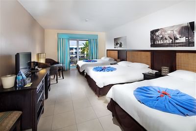 Triple beds in a room at Playa Blanca Beach Resort