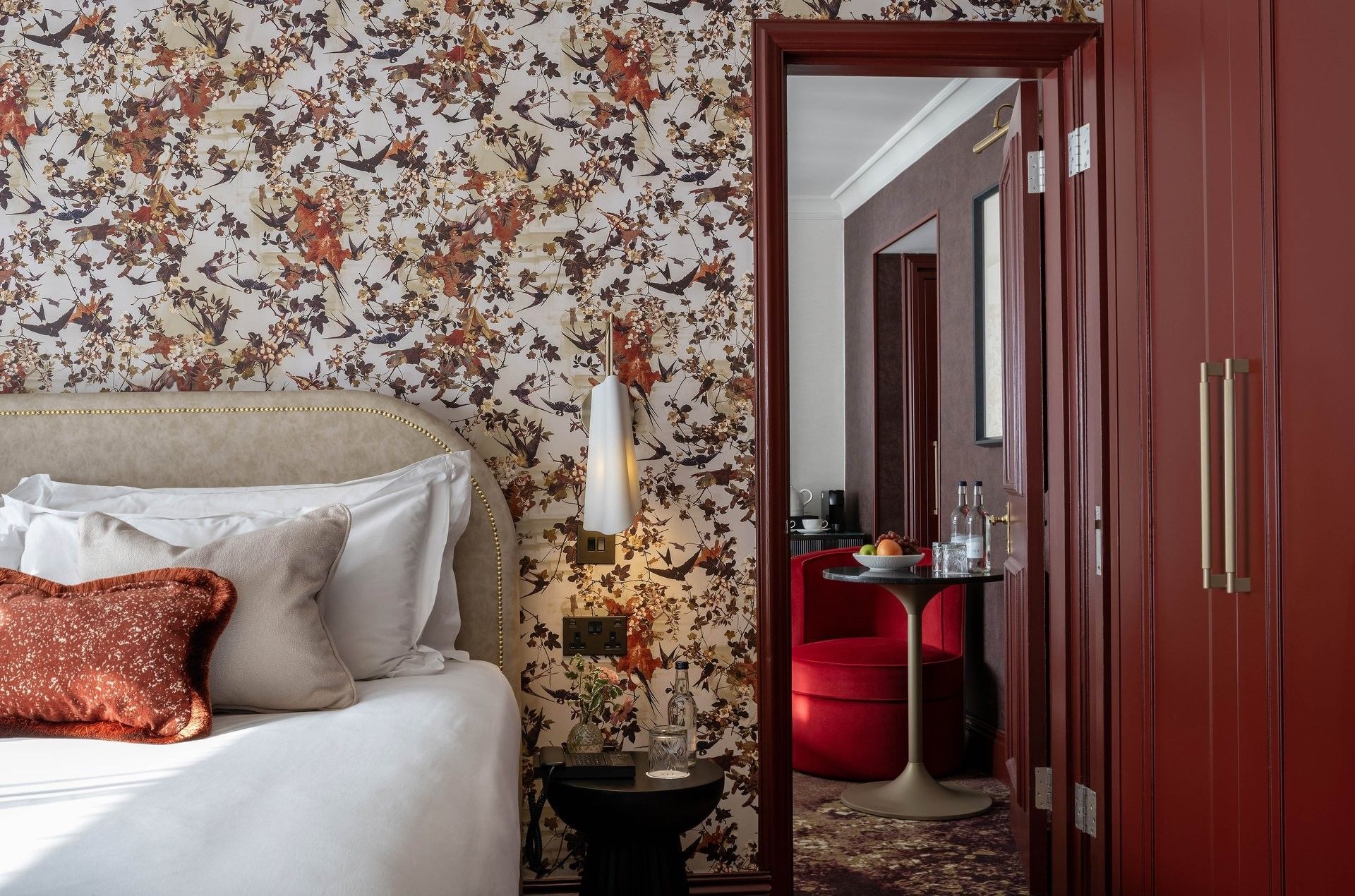 Close-up of bed with side table and mirror in Superior King at The Capital Hotel, Apartments and Townhouse