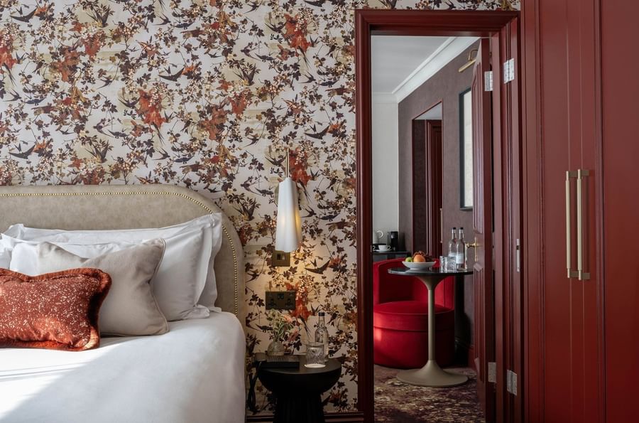 Close-up of bed with side table and mirror in Superior King at The Capital Hotel, Apartments and Townhouse