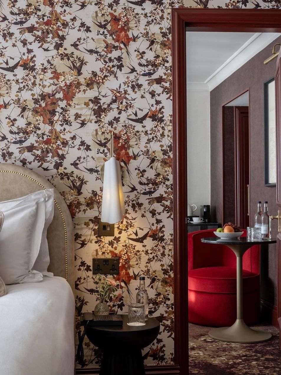 Close-up of bed with side table and mirror in Superior King at The Capital Hotel, Apartments and Townhouse