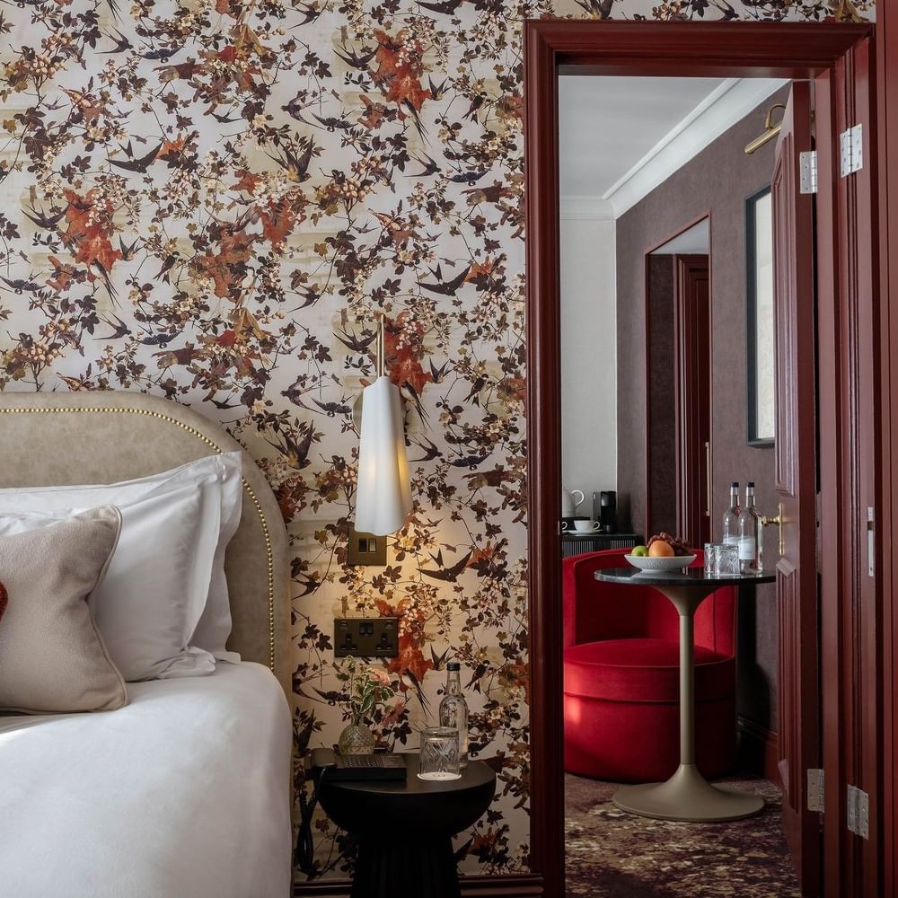 Close-up of bed with side table and mirror in Superior King at The Capital Hotel, Apartments and Townhouse