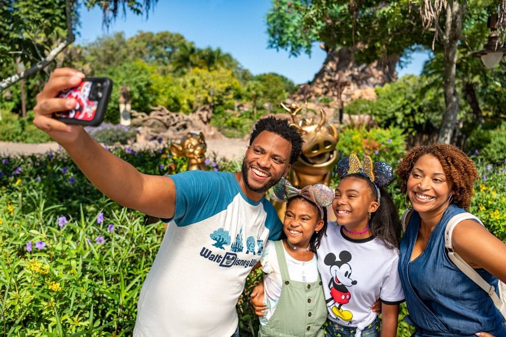 Family taking selfie in Disney’s Animal Kingdom Theme Park near Lake Buena Vista Resort Village & Spa