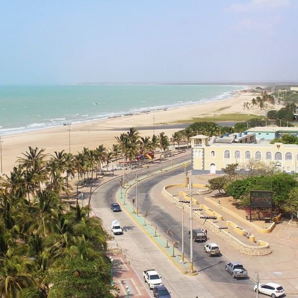 Aerial view of streets and ocean in Riohacha near DOT Hotels