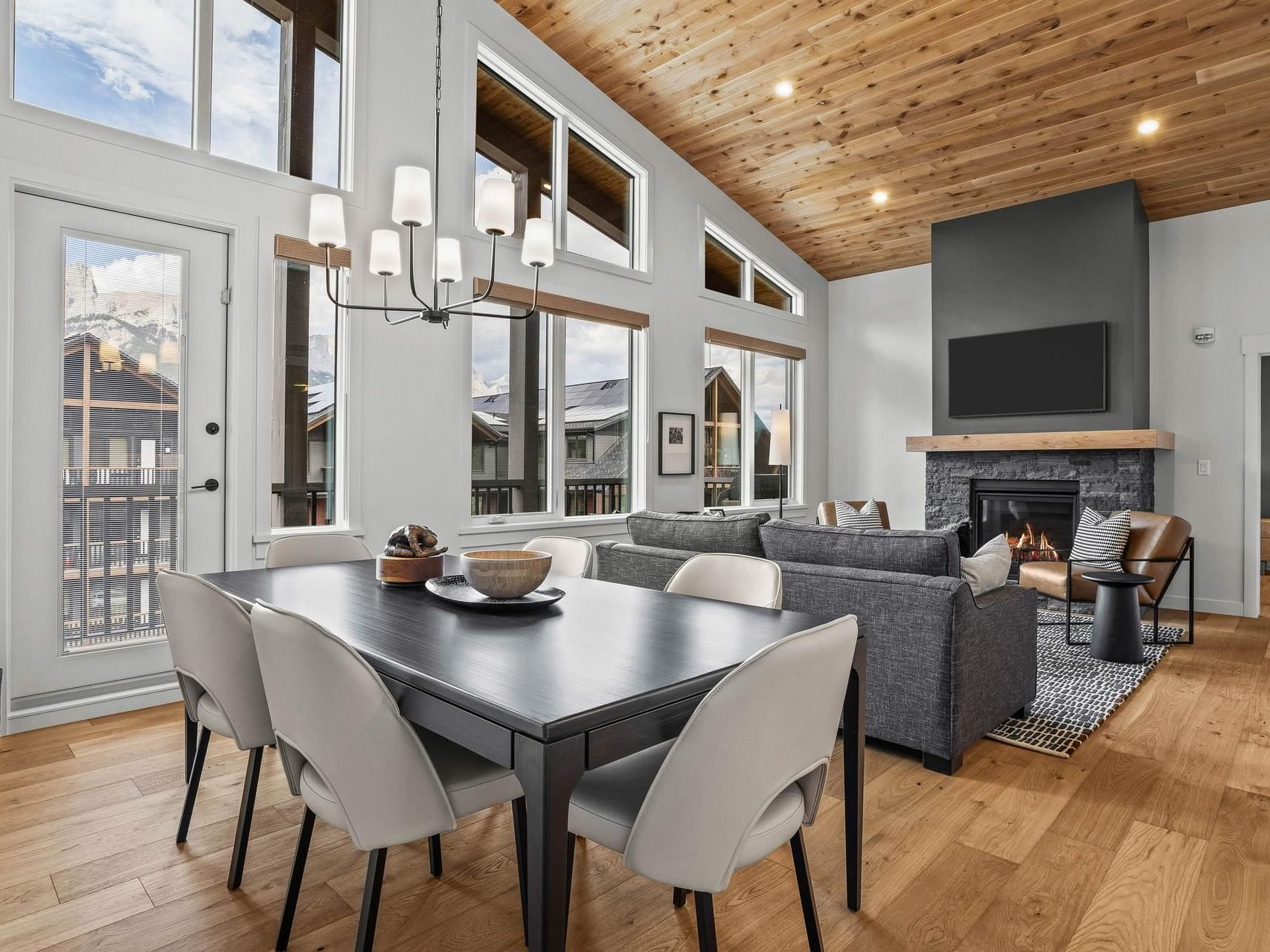 411 Timberstone Lodge Two Bedroom Elevated Condo dining and living room with fireplace at Spring Creek Vacations