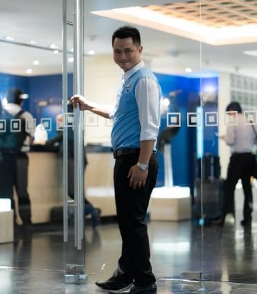 A man is getting ready to open a door at Dream Thailand Bangkok