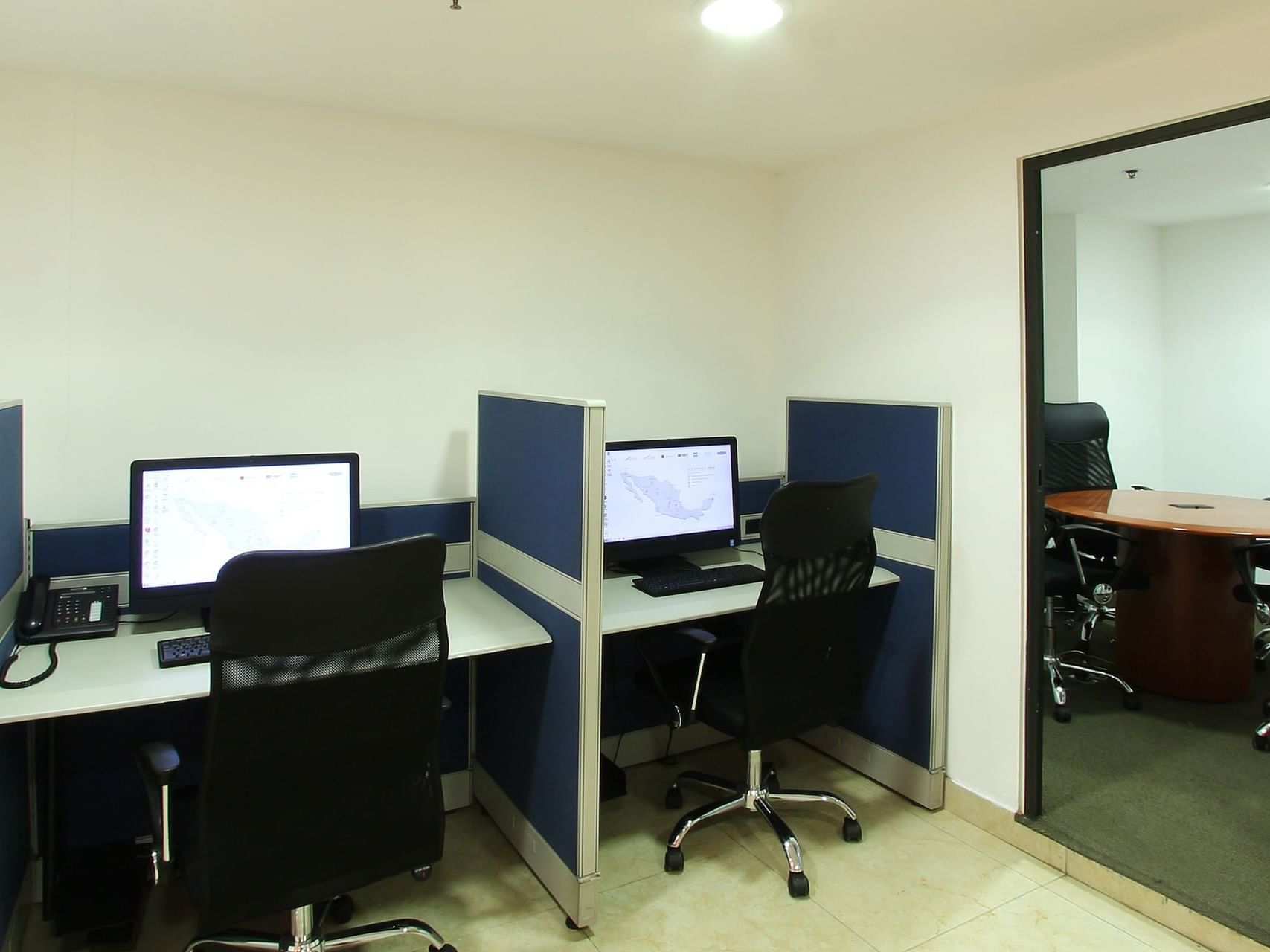 Separated workstations in a business center at One Hotels