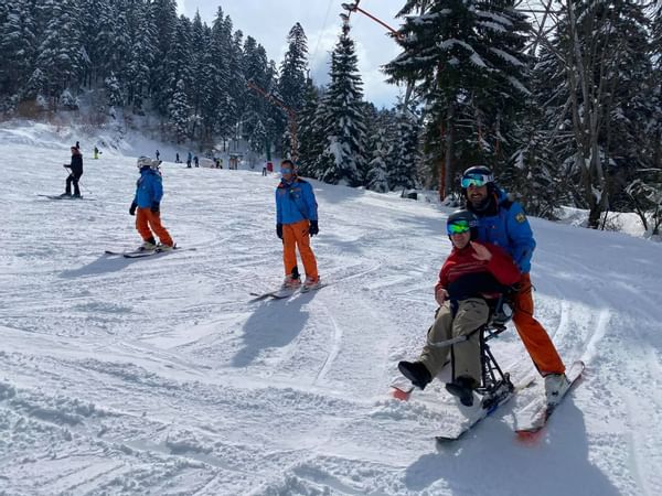 People engaged in skiing on snowy mountains near Ana Hotels