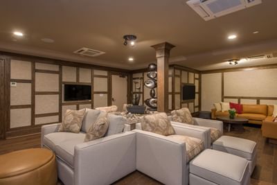 Relaxing lounge area with comfortable sofas and a modern water feature at The Abbey Inn & Spa