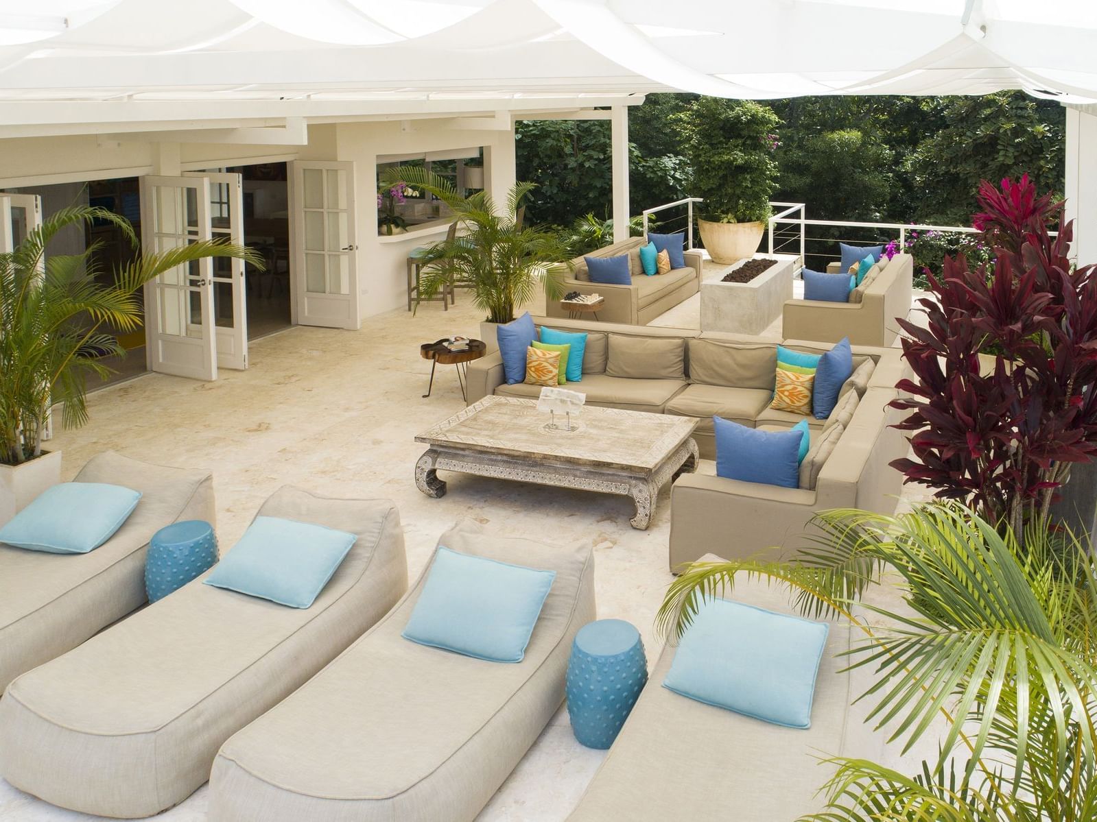 Terrace area with lounge beds and sofas at Costa Rica