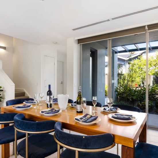 Dining table arranged in Deluxe Three Bedroom at Pullman Magenta Shores Resort