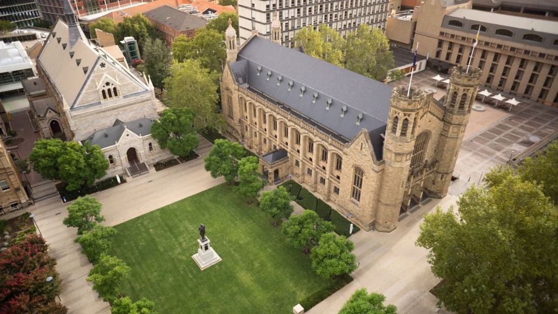 Aerial view of the University of Adelaide's North Terrace campus, featuring green lawns near Ibis Adelaide