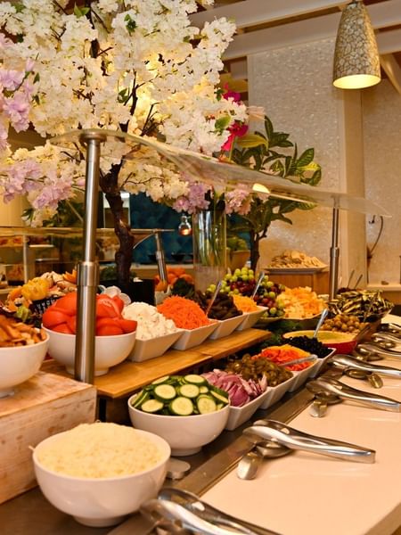 Flower-adorned buffet spread with various food dishes at Warwick Paradise Island - Bahamas, Nassau.