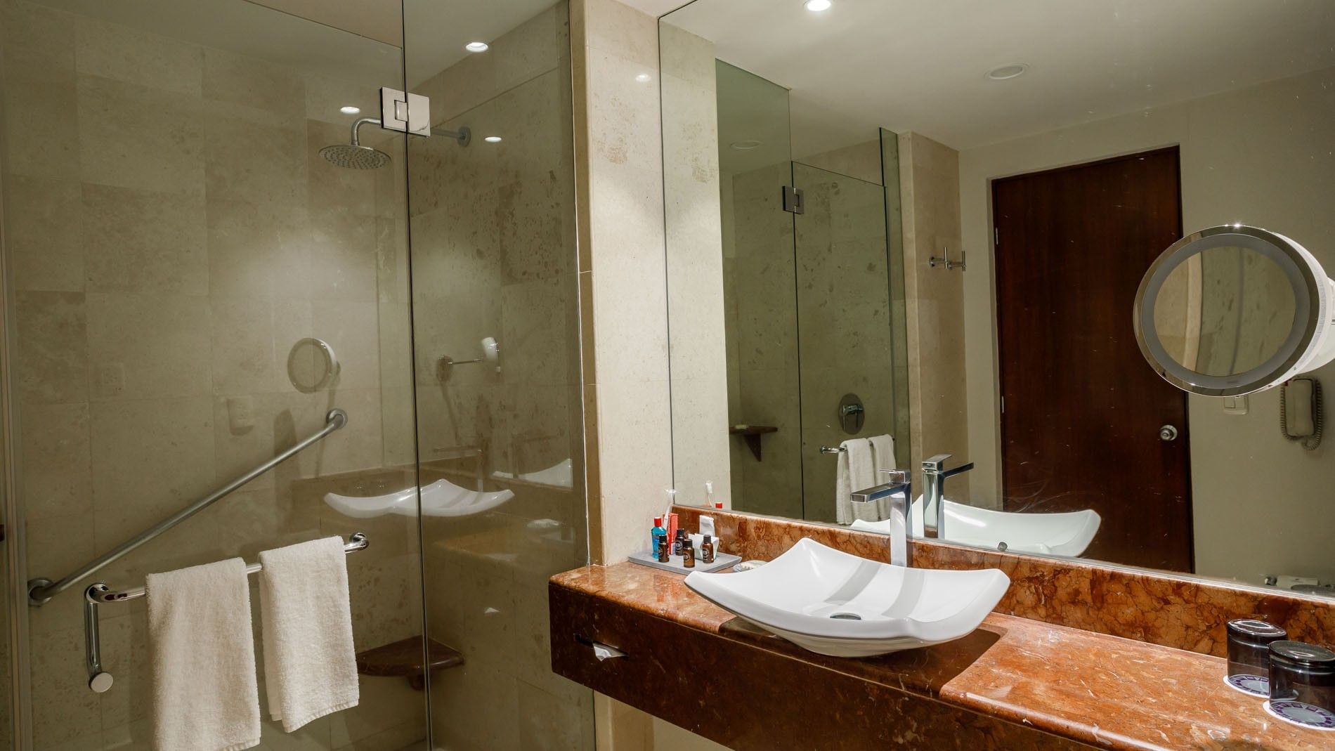 King Camino Real Club bathroom featuring a marble vanity, square sink, and glass shower at Camino Real Pedregal Mexico