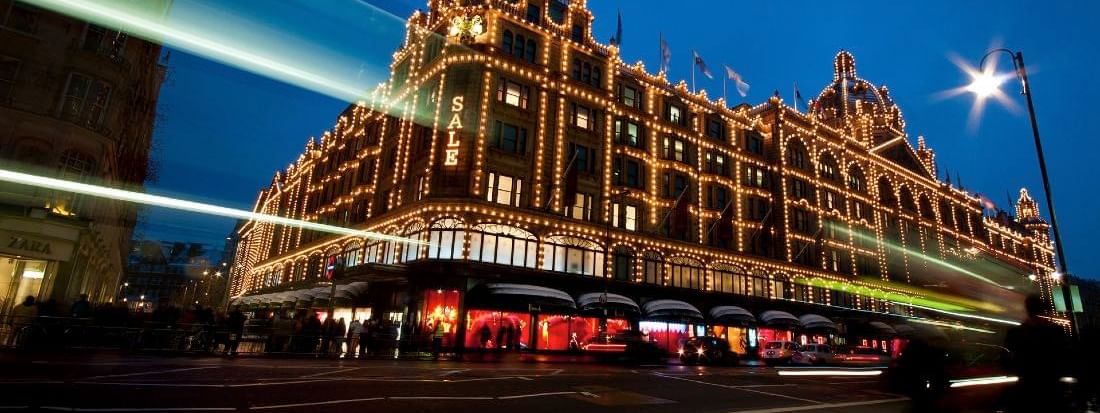 Exterior night view of Grade II listed luxury department store near Warwick hotels & resorts