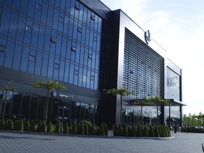 An exterior view of the hotel & main entrance at Village Hotels
