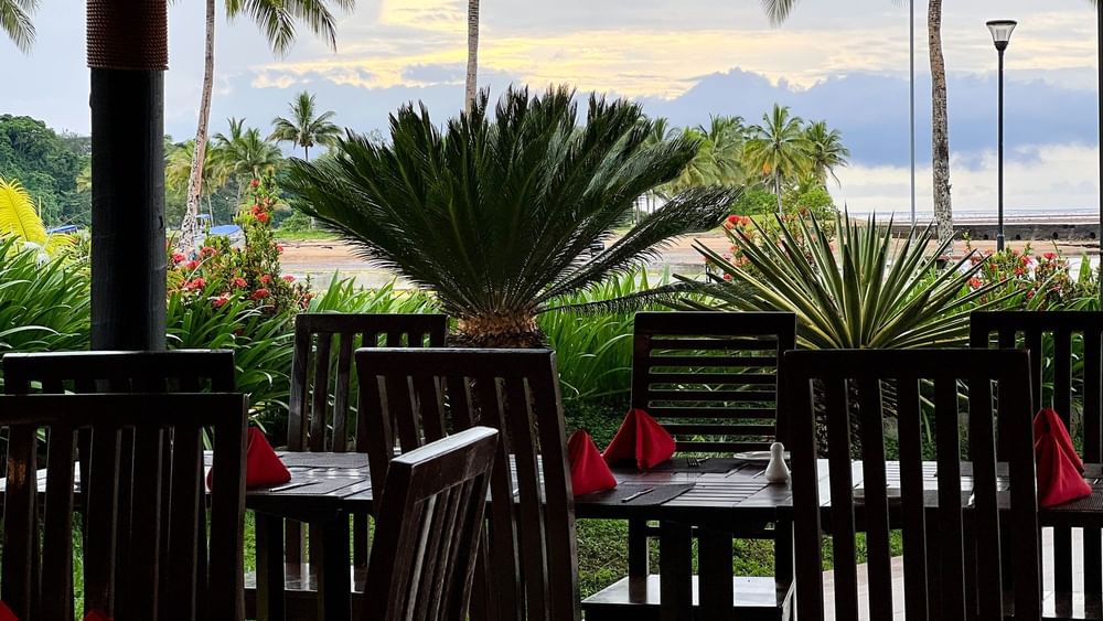 Chairs and tables with red napkins in Nukunuku Restaurant & Bar at The Naviti Resort Korolevu.
