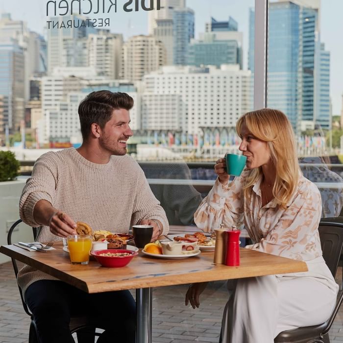 Couple eating breakfast at ibis restaurant