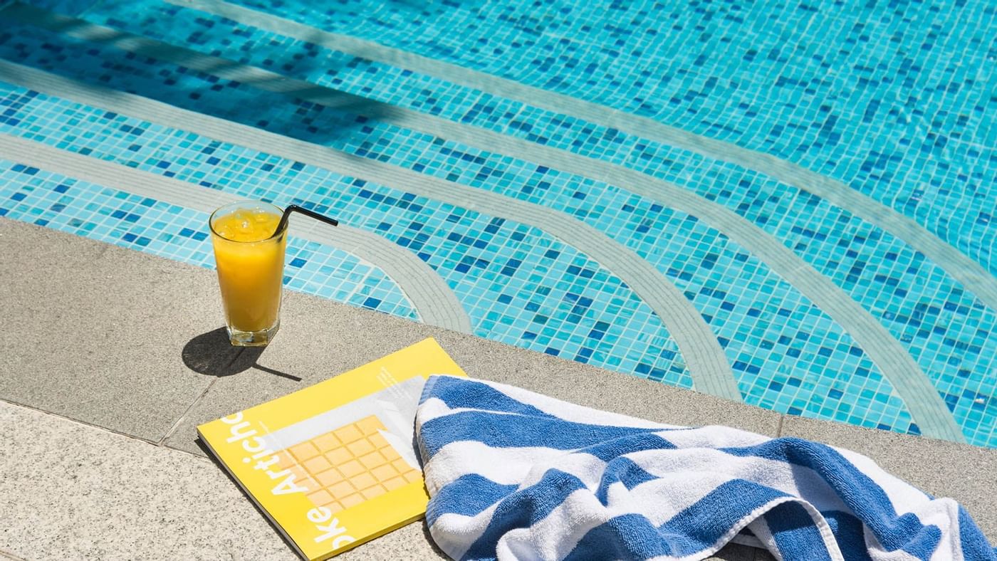 Fresh juice & towel near the pool at Crown Promenade Perth