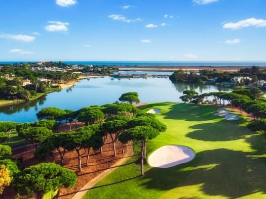 Aerial view of South Golf Course on a sunny day near The Magnolia Hotel