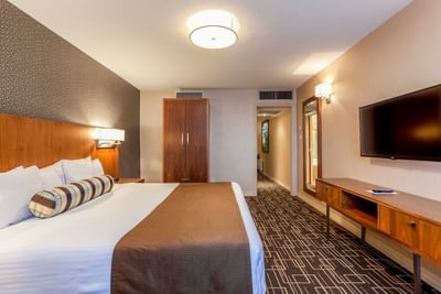 King bed, wardrobe and wall mounted TV.