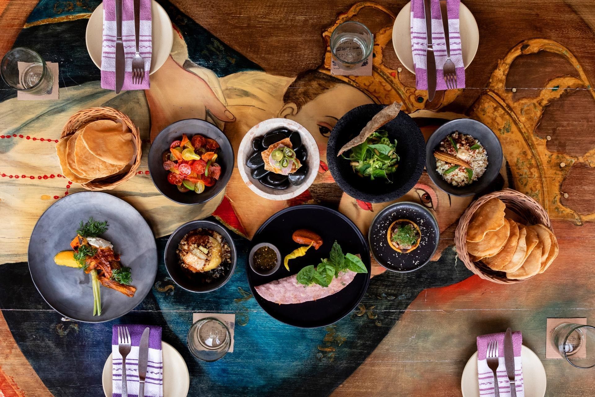 La Zebra Tulum Mexican coastal dining spread with seafood, tacos, sauces and fresh dishes.