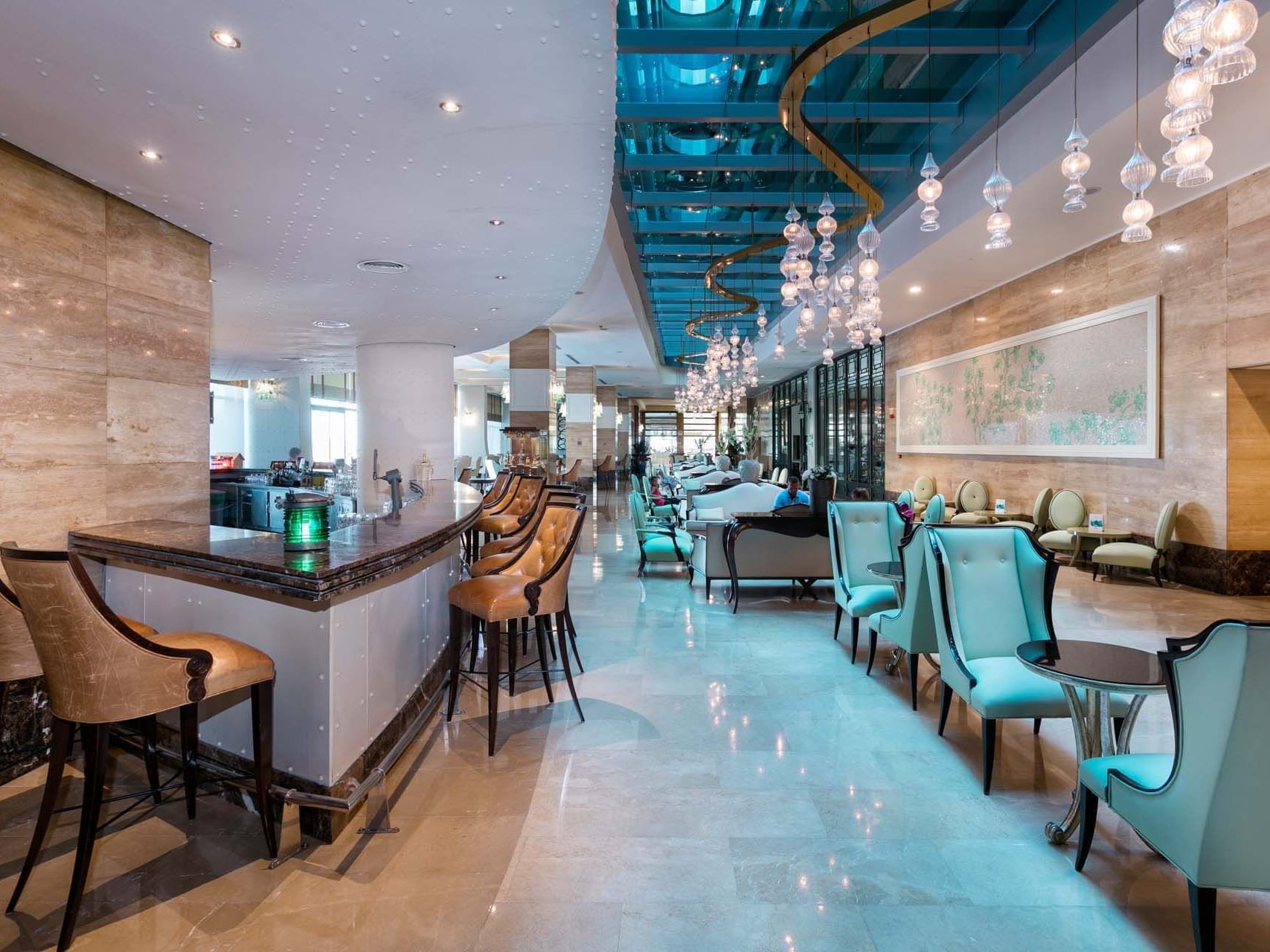 Interior of Caprice Lobby Bar with seating area at Titanic Deluxe Lara