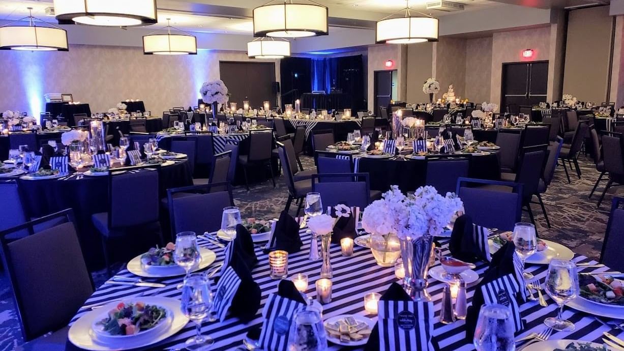 Wedding arrangements with elegant lighting and floral decorations in Roosevelt Ballroom at Shangri-La Monkey Island