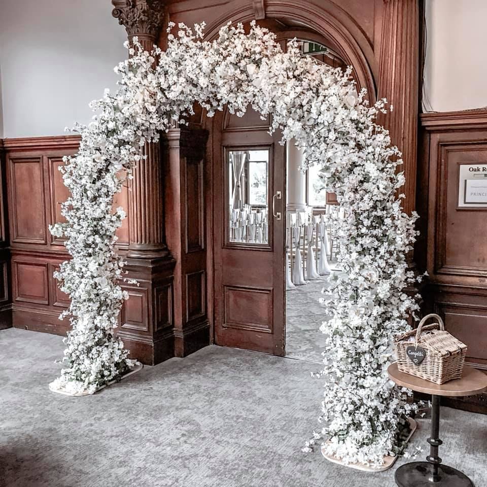 Wedding arch with white flowers in The Oak entrance, wedding venues in York at The Milner York