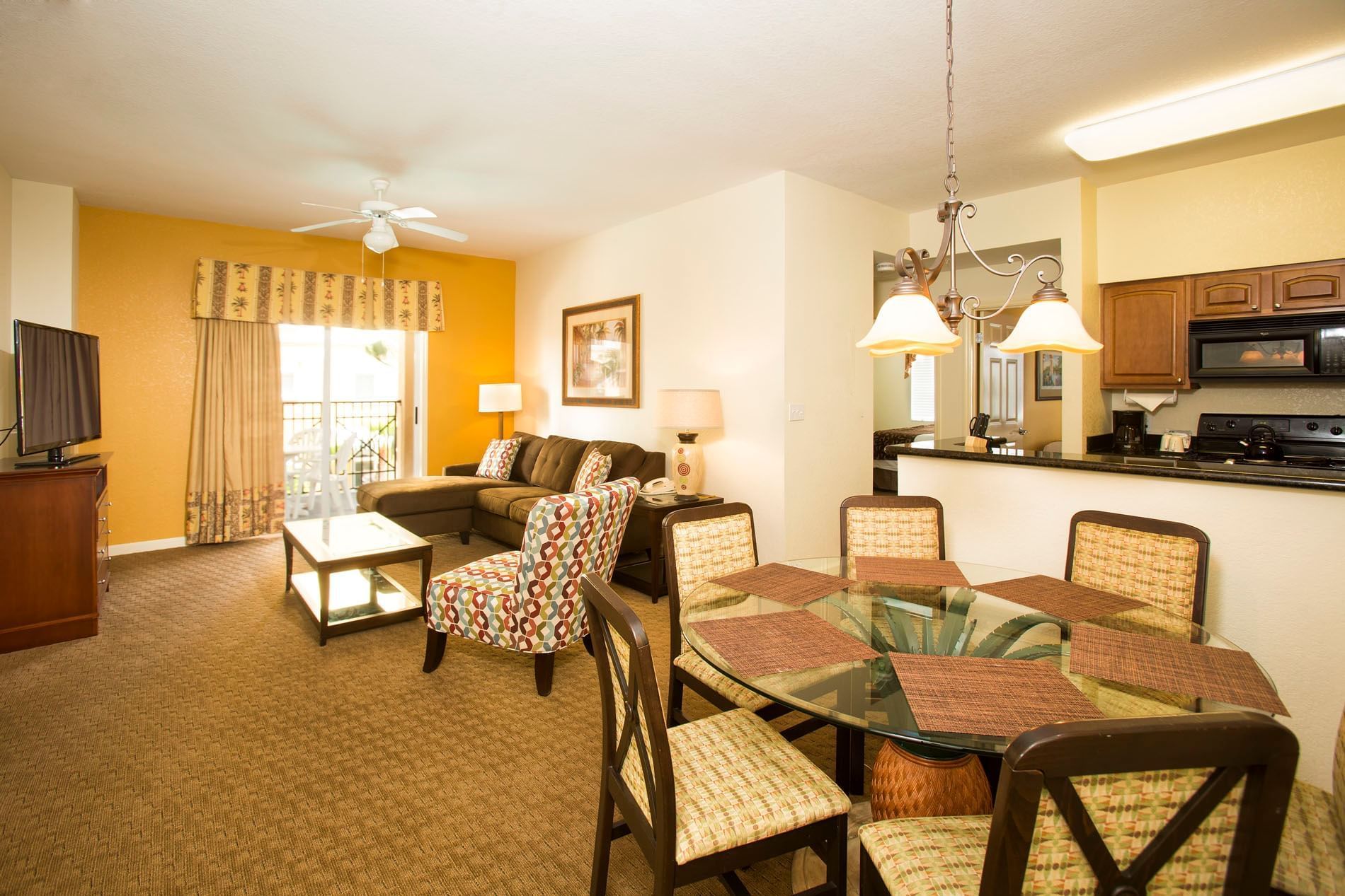 Living room and dining room in one of our spacious orlando suites