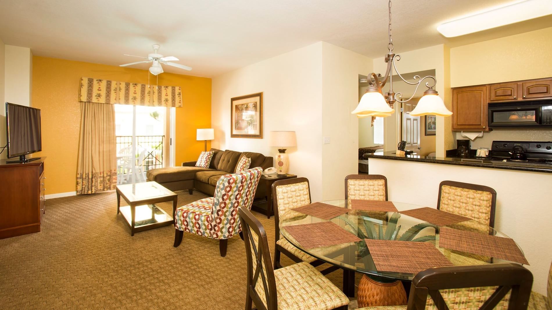 Living room and dining room in one of our spacious orlando suites