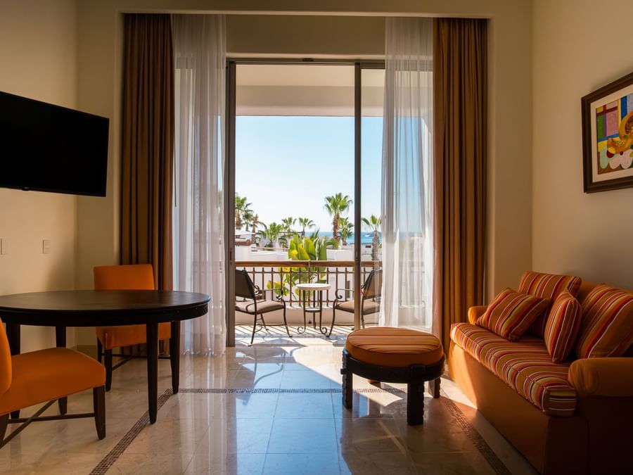 Junior Suite Garden view featuring a comfortable living area and a private balcony at Marquis Los Cabos Resort