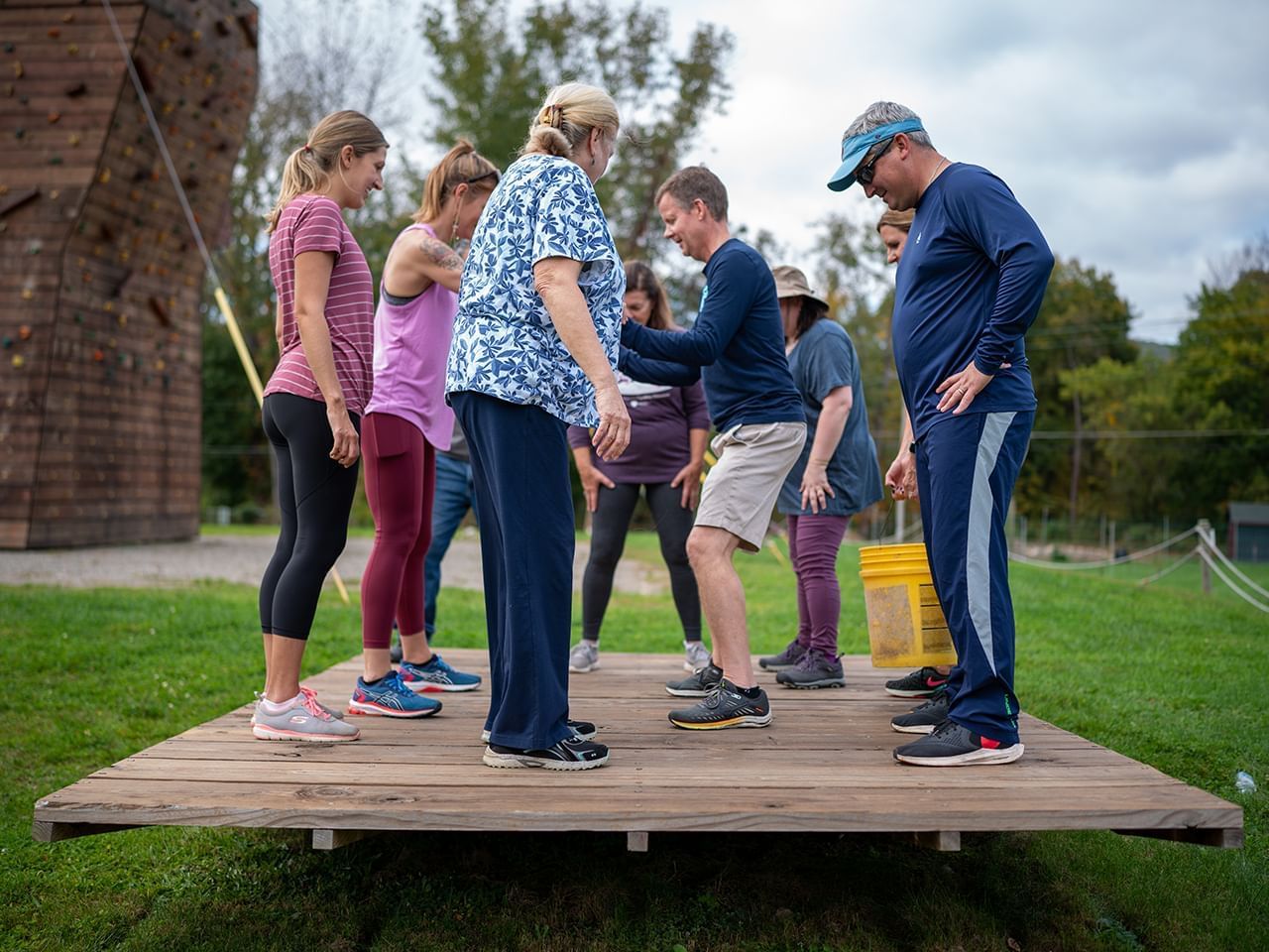 Guests standing on a balancing pallet at Honor’s Haven Retreat