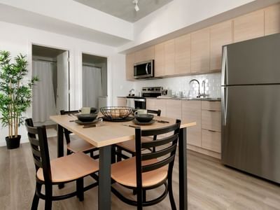 The 4-bedroom shared apartment has a full and modern kitchen with stainless steel appliances.