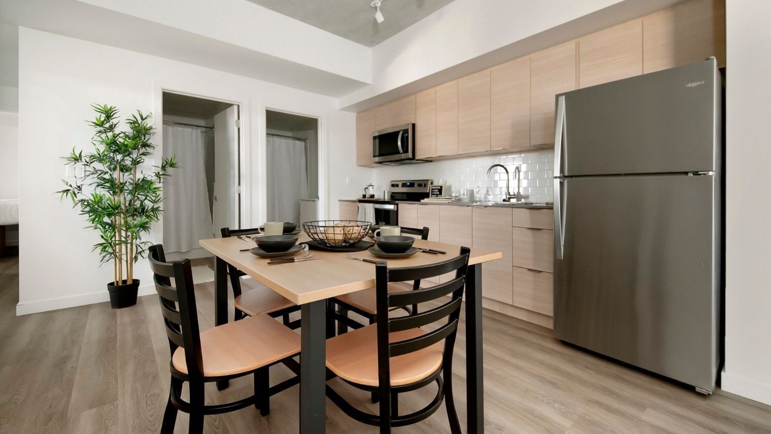 The 4-bedroom shared apartment has a full and modern kitchen with stainless steel appliances.
