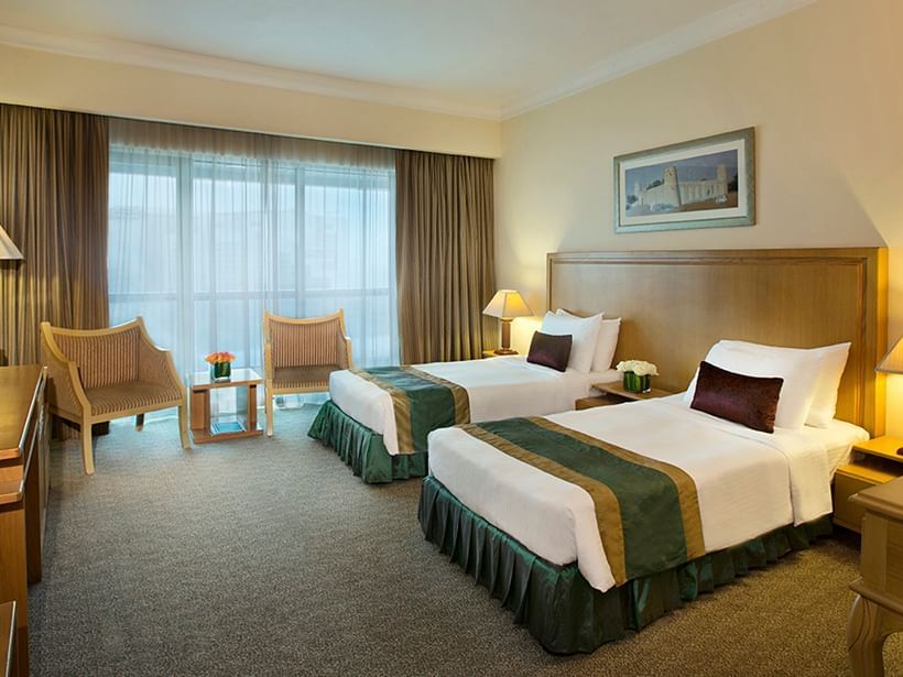 Comfy twin beds in Deluxe Twin Room at City Seasons Hotels