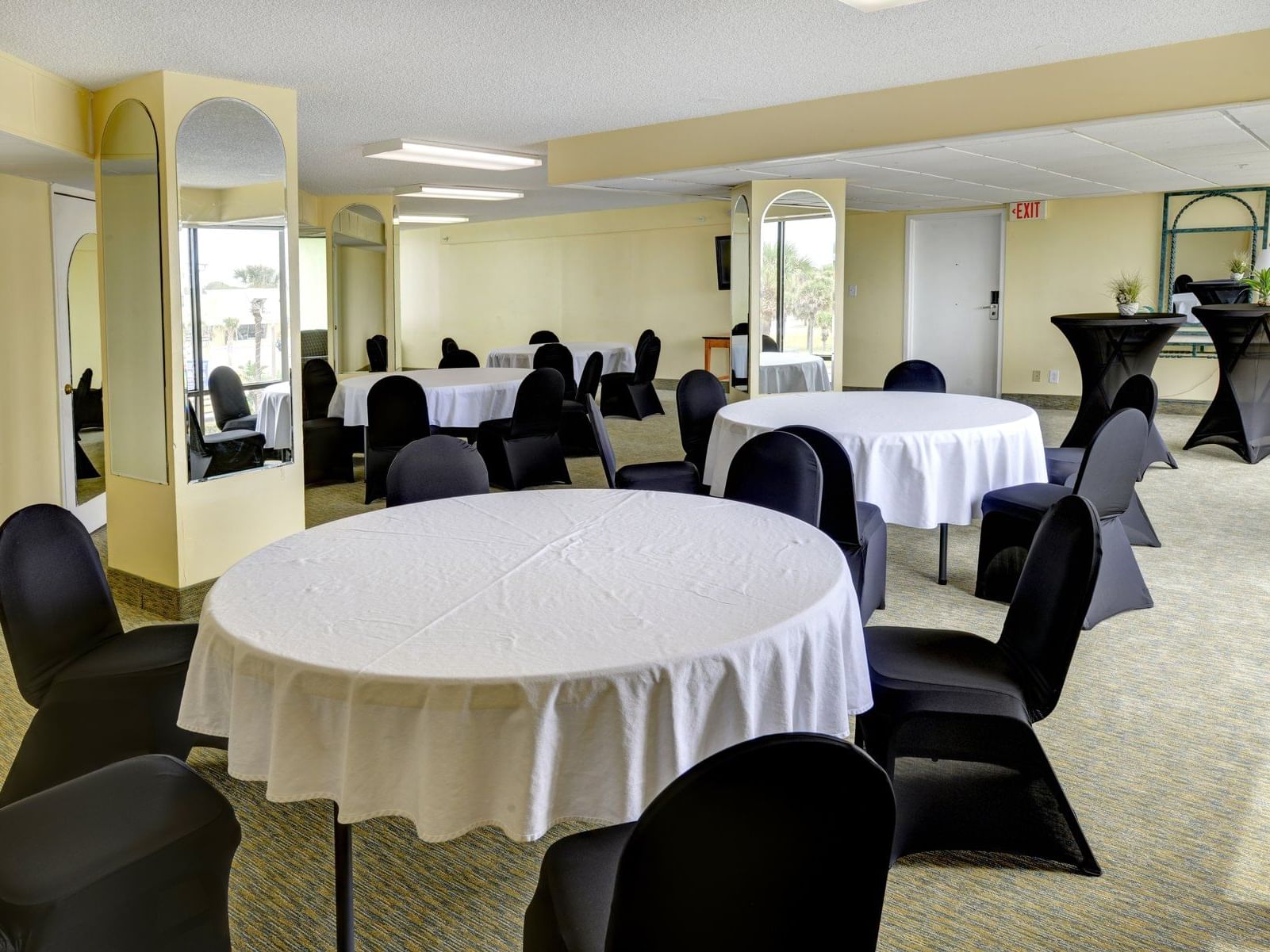 Meeting room with round conference tables.