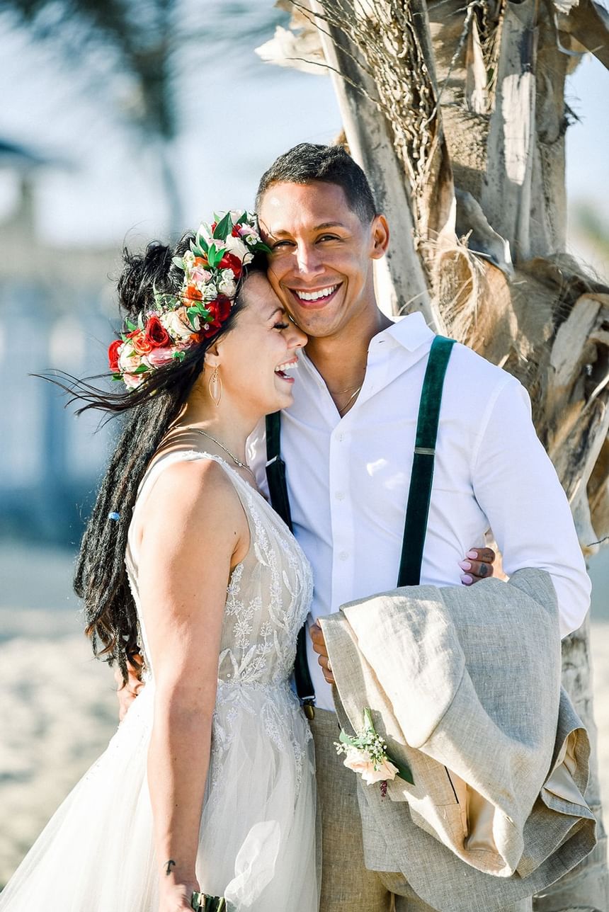 Portrait of the bride & groom by beach, Ocean Place Resort