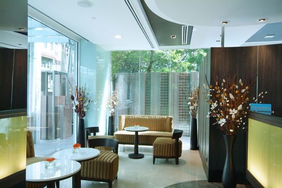 Lobby area with comfortable chairs at Amora Neoluxe Hotel